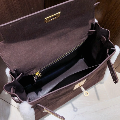 Dark Chocolate Suede Structured Top Handle Bag With White Fluffy Side Trim, Polished Golden Twist Hardware And Spacious Zipper-Lined Interior