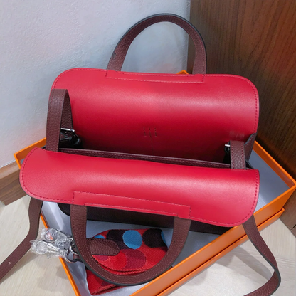 Dual-Tone Burgundy Red Trapezoidal Flap Bag With Integrated Loop Handle, Metallic Buckle Fastener And Slim Matching Shoulder Strap