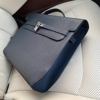 Prussian Blue Elongated Document Hand Bag With Pebble Grain Surface, Silvery Twist Lock Hardware And Slim Curved Top Grip Handle