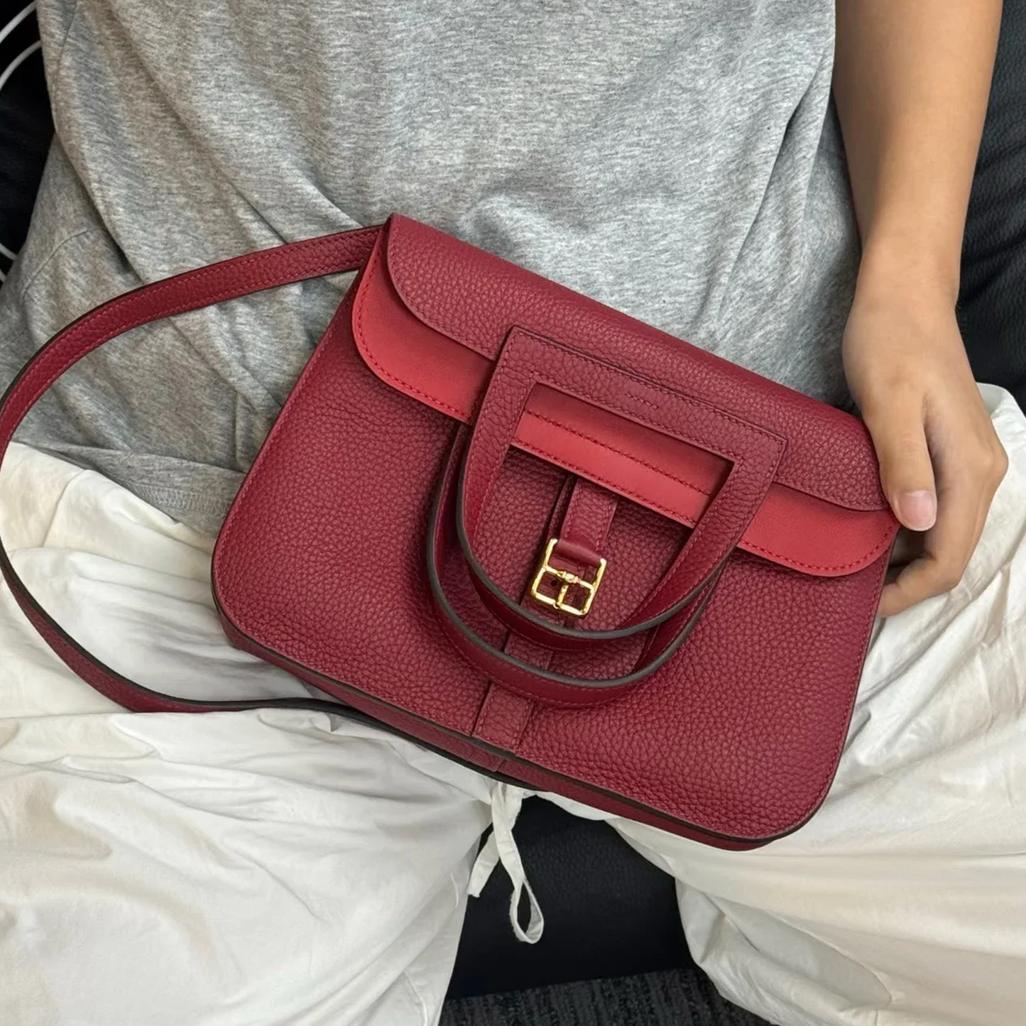 Dual-Tone Burgundy Red Trapezoidal Flap Bag With Integrated Loop Handle, Metallic Buckle Fastener And Slim Matching Shoulder Strap