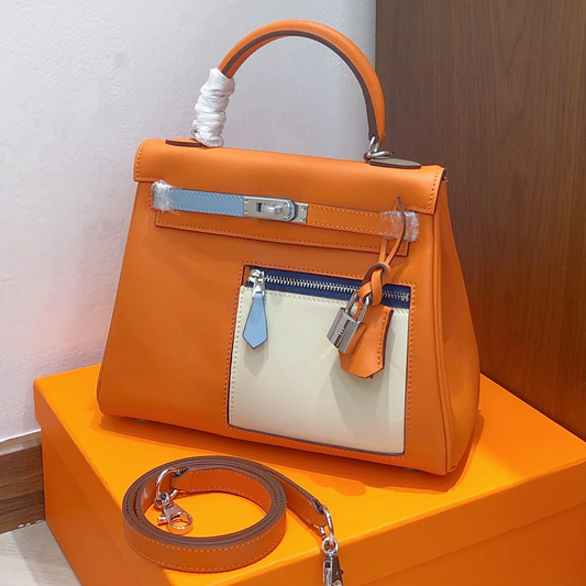 Vibrant Orange Color Block Structured Top Handle Bag With Multi-Tone Accent Panels, Silvery Twist Hardware And Matching Slim Shoulder Strap