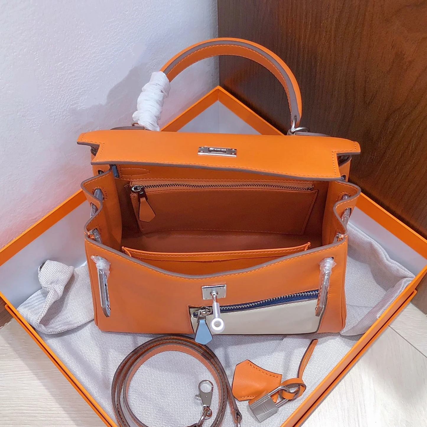 Vibrant Orange Color Block Structured Top Handle Bag With Multi-Tone Accent Panels, Silvery Twist Hardware And Matching Slim Shoulder Strap
